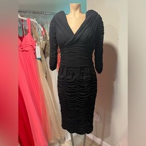 Black Ruffle VNeck with beaded “belt” waist band. Size 12.